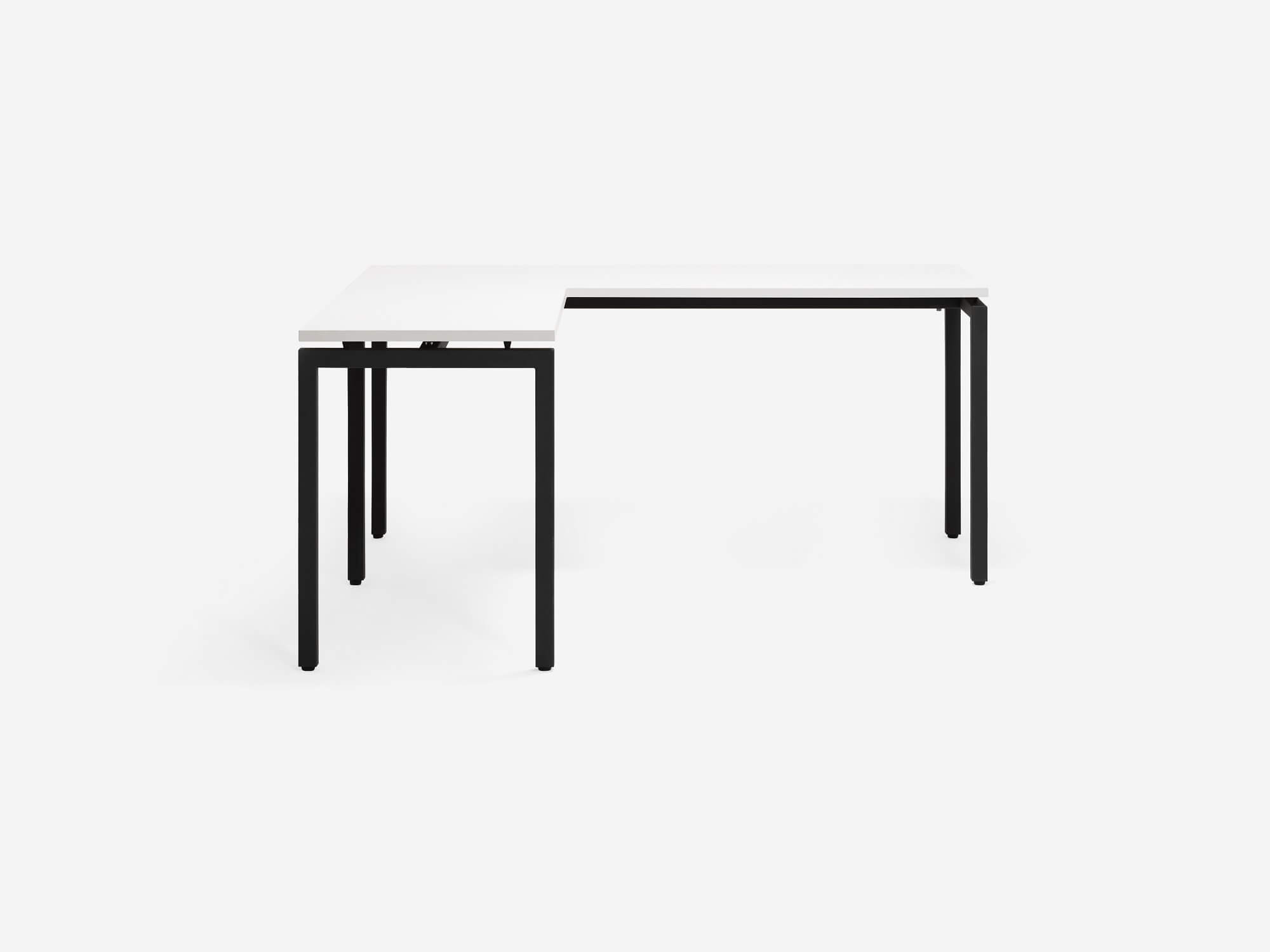 Front view of the Novah custom left hand l shaped desk with white top and black base